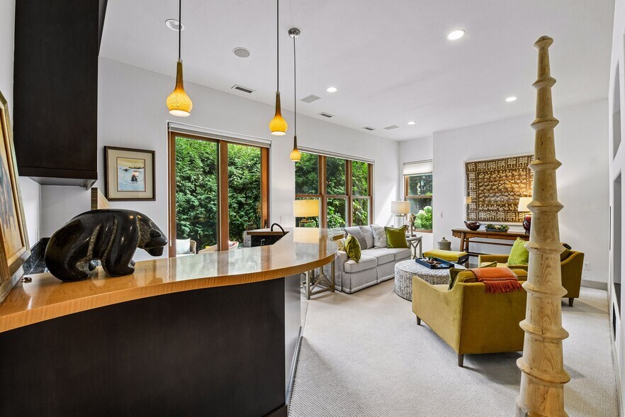 The lower level offers entertaining space, a wet bar, exercise room, and access to the walkout patio - 745 Rice St E