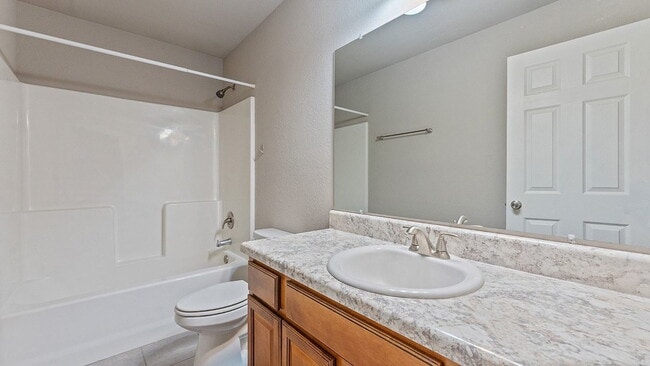 Building Photo - Spacious 4-Bedroom with Elegant Granite Finishes