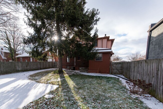 Building Photo - Beautifully updated Tudor style duplex. Up...