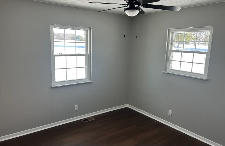 Bedroom #3 with new fixture and flooring - 2751 Hart Rd