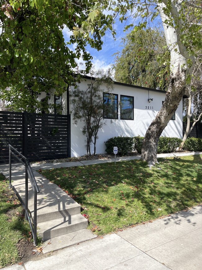 Front of Triplex with secured gated access and perimeter security cameras - 3211 W Alameda Ave