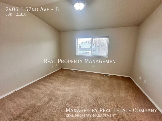 Building Photo - 2406 E 52nd Ave