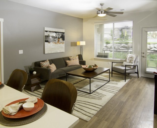 Open Living Space with Ceiling Fan - Lofts at 7800 Apartments