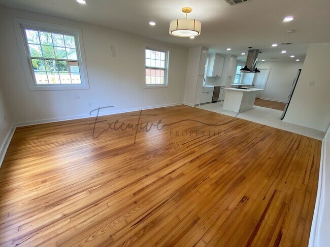 Building Photo - Spacious 4-Bedroom with Custom Finishes in...