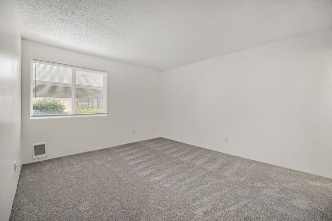 Building Photo - AVAILABLE NOW! 2BR/2BA Condo – Awesome Location! Glossy Hardwoods, Granite Countertops, W/S/G Inc...