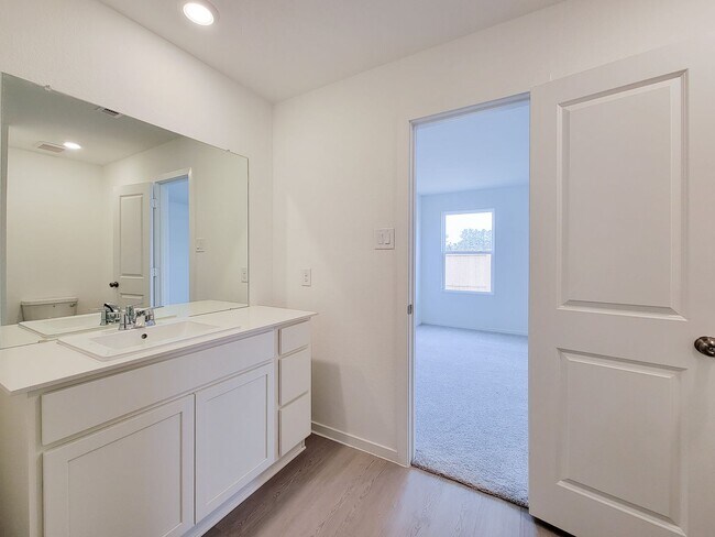 Building Photo - This great new single-story design makes smart use of the space available. At the front are all t...