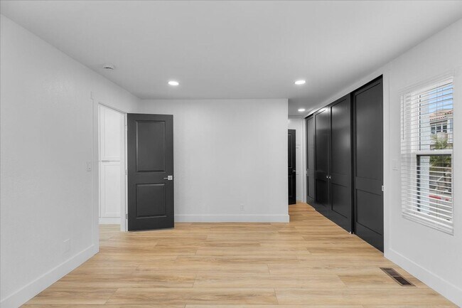 Building Photo - COMPLETELY REMODELED, BRIGHT & AIRY, TRI-LEVEL HOME W/ TOP-FLOOR GREAT ROOM LIVING SPACE, 2-CAR G...