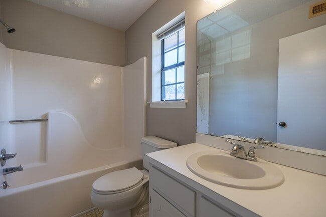 Building Photo - ONE FREE MONTH ON 13 MONTH LEASE! Welcome to this charming 3-bedroom, 2-bath condo located in the...