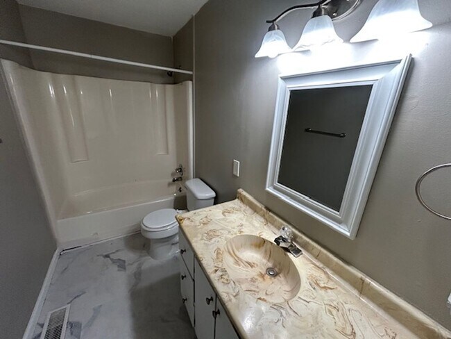 Building Photo - Spacious 4-Bedroom, 2-Bath Home Located in...
