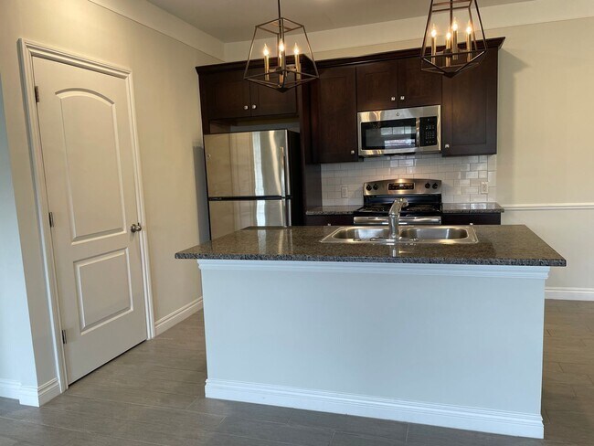 Building Photo - Shelby Township, 1st Floor  2-Bedroom, 2- Baths, Private Patio with att. Garage