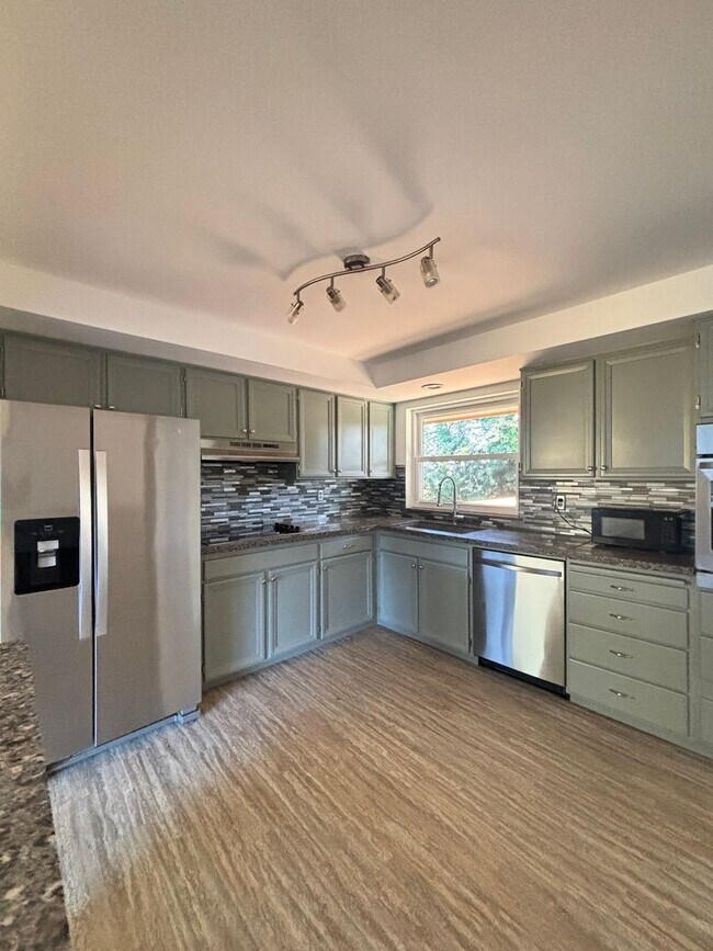 Building Photo - Gorgeous 4-Bd House | Huge Deck, Huge Fenced Yard, & Bonus Room!