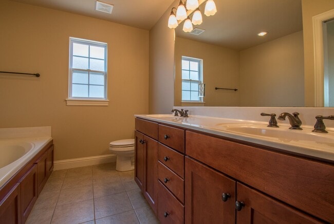 Building Photo - Luxurious Executive Row House in Northeast Fayetteville! Lawn care included!