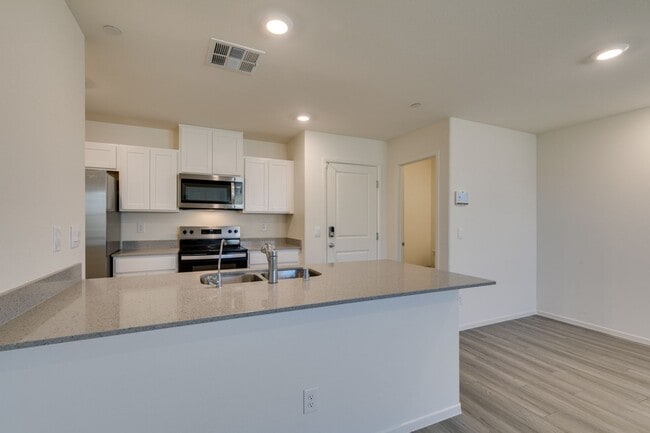 Building Photo - Gorgeous Townhome with upgrades in gated community* 3 large bedrooms, 2 car garage*Community pool...