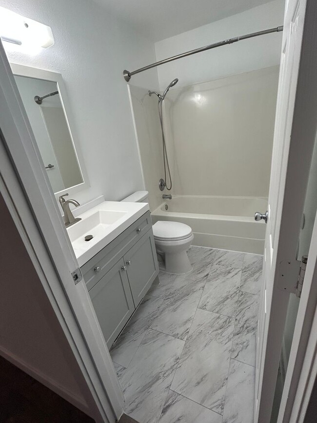 Building Photo - Beautifully Remodeled 2 Bedroom 1 Bath Duplex w/ Large Yard!! Pets are welcome! Electric car char...