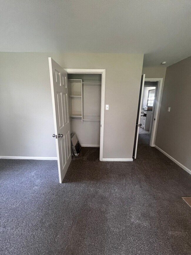 Building Photo - Freshly updated home with privacy fence in...