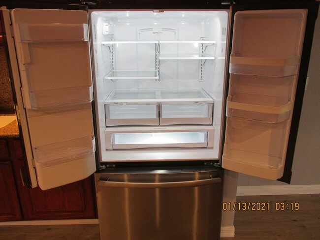 Building Photo - Remodeled !  Hardwood Flooring Throughout & New Carpet in Bedrooms, Tile, Granite, Large Living r...