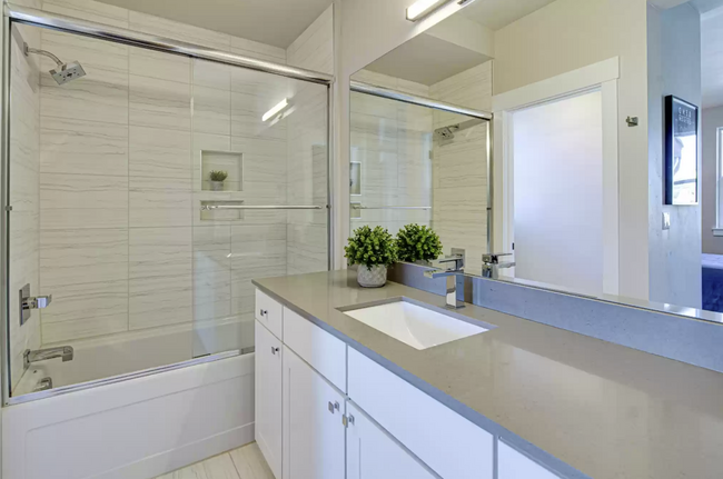 Primary suite bathroom with bathtub and shower - 20563 Gloucester Ln