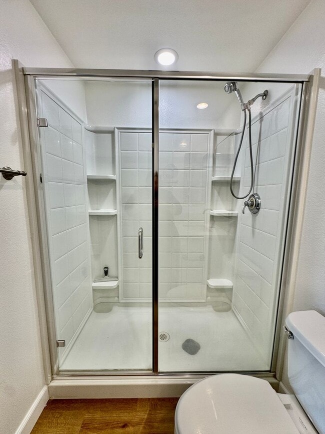 Building Photo - Beautifully Remodel Townhouse with AC & Two Car Garage!