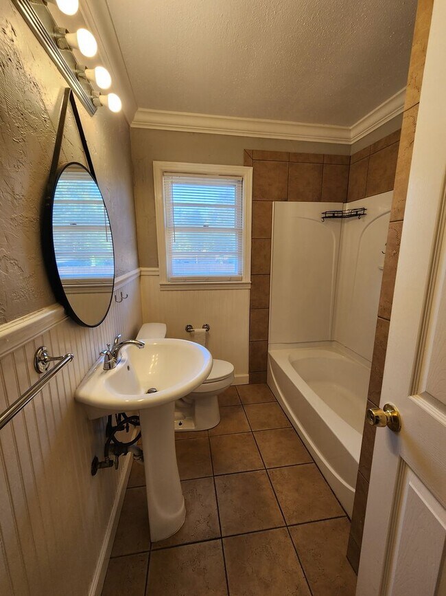 Building Photo - Spacious 4BR/2BA Brick Home with Fireplace, Large Island!