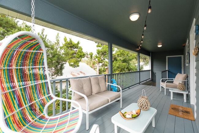 Fun porch swing to sit in and listen to the waves - 208 C St