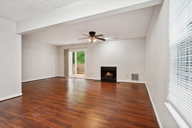 Spacious great room opens to the back deck & the fully fenced backyard - 1644 Skiffes Creek Cir