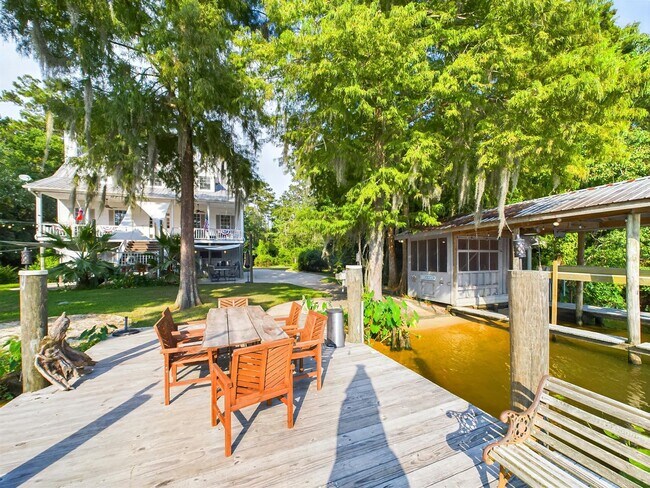 Building Photo - Private Furnished Riverfront Estate with Dock & Guest Apartment