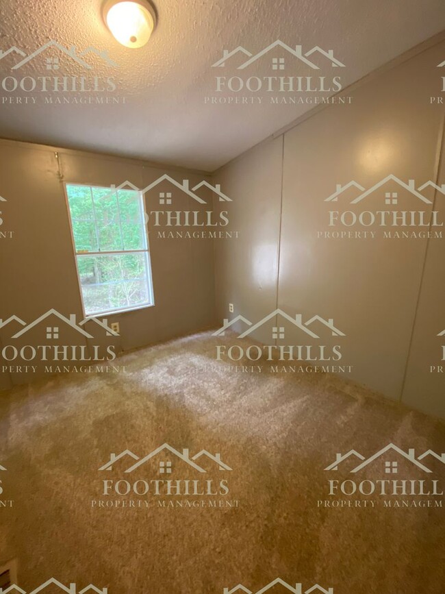 Building Photo - Spacious 4-Bedroom Double-Wide Mobile Home...