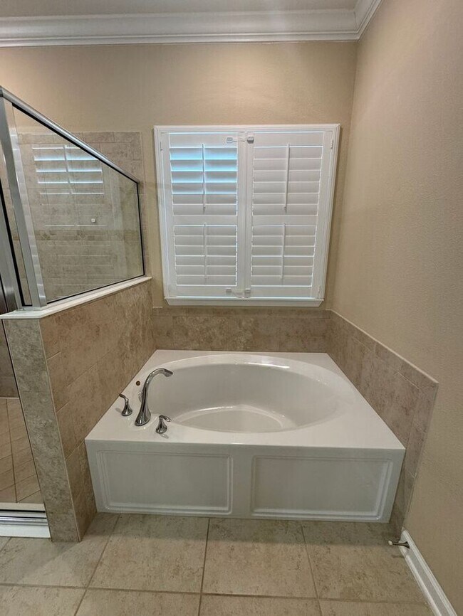 Building Photo - COMING SOON! Beautiful 4BR 3BA Home w/ Screened Lanai & Pond View • Garage Parking • Fenced Yard ...