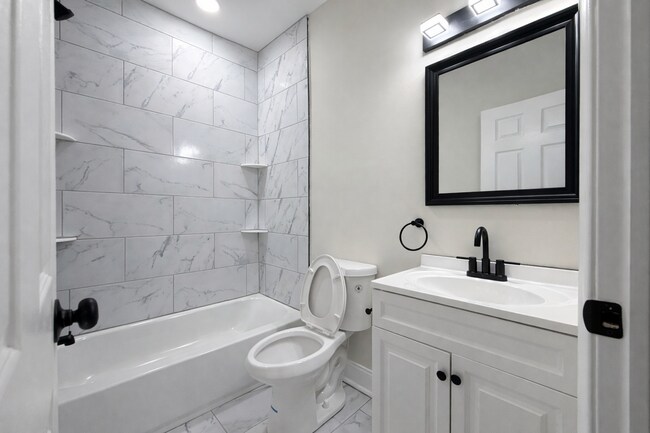 Building Photo - Modern 3BR Rowhome with Finished Lower Level & Rear Deck