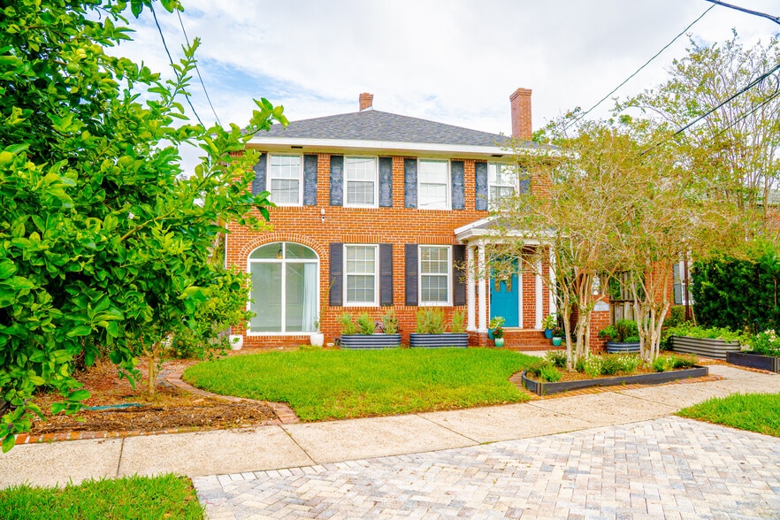 Exterior of two-story brick house with crepe myrtles, lime and lemon tree - 1215 Landon Ave