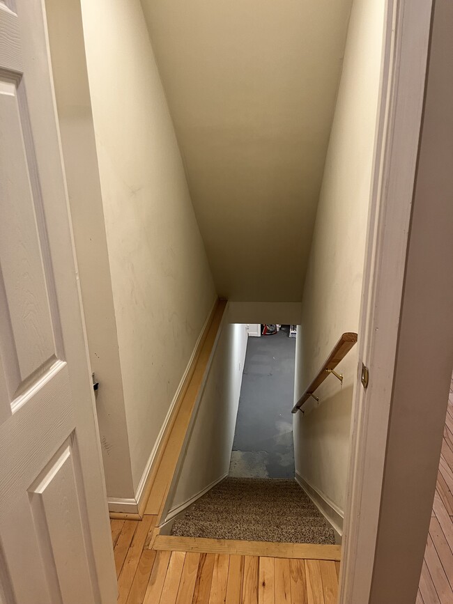 stairs to basement with storage - 2410 Fleet St