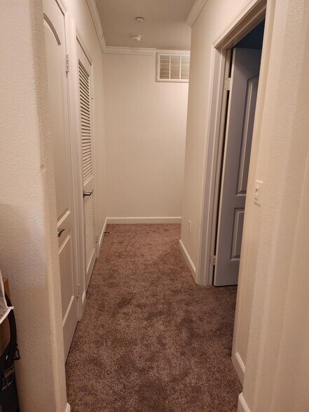 Hallway from entrance to second bedroom and bath - 1021 Costa Pacifica Way