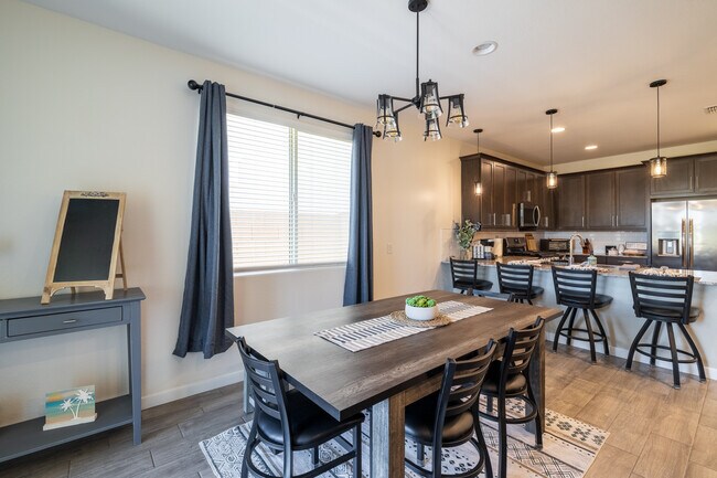 Dining area with counter stools - 8924 W Solano Dr