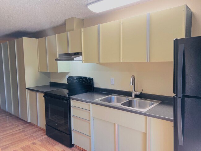 Building Photo - Charming 3BR/1BA w/ 1-car garage, long driveway, fenced yard, wood stove & shed/workshop.