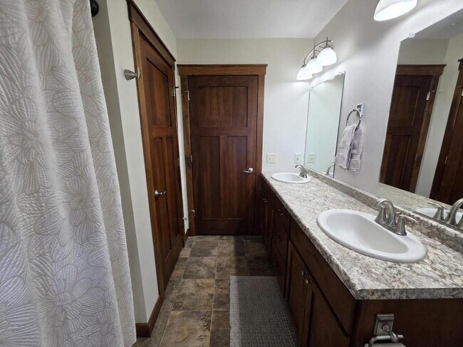 Building Photo - FREE SEPTEMBER RENT for this Spacious 4-Bedroom Home with Vaulted Ceilings with Finished Basement...