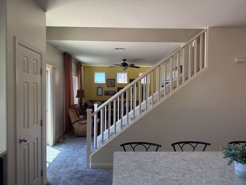Stairs from kitchen - 900 W Broadway Ave