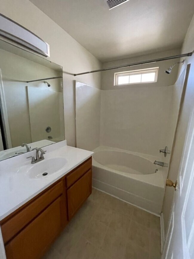 Building Photo - Must see this 4 bedroom 2.5 bath townhouse with 1 car garage .