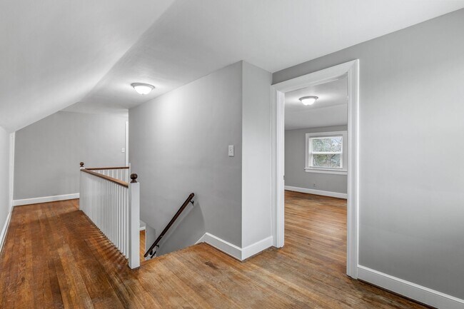 Building Photo - Brick home, Two Story, Hardwoods, DR, 2 Sun Rooms, FP, Carport!.