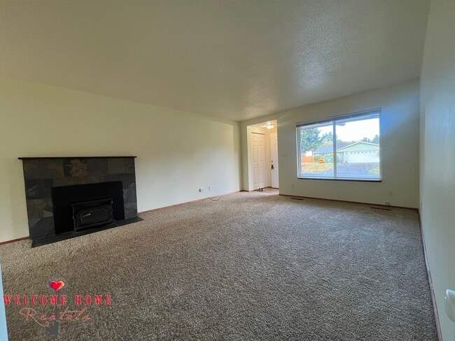 Building Photo - Beautiful Remodeled Rambler!!!  Come enjoy this HUGE backyard!!  NEW CARPET!!