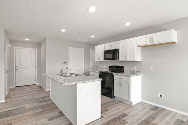 Building Photo - 4 bedroom home with a fenced in yard!