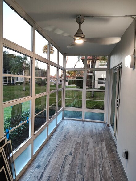 Lanai with ceramic tile and Solar glass single hung windows - 10 Vista Palm Ln