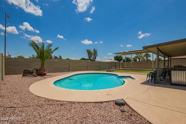 Building Photo - Beautiful three-bedroom, two-bath with pool and RV parking, available now.