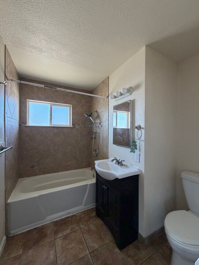 Building Photo - 3 Bedroom 2 Bathroom House with Central A/C , 2 Car Garage and Beautiful Backyard with Covered Patio