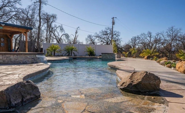 Building Photo - A Private Oasis with Unmatched Amenities 4...