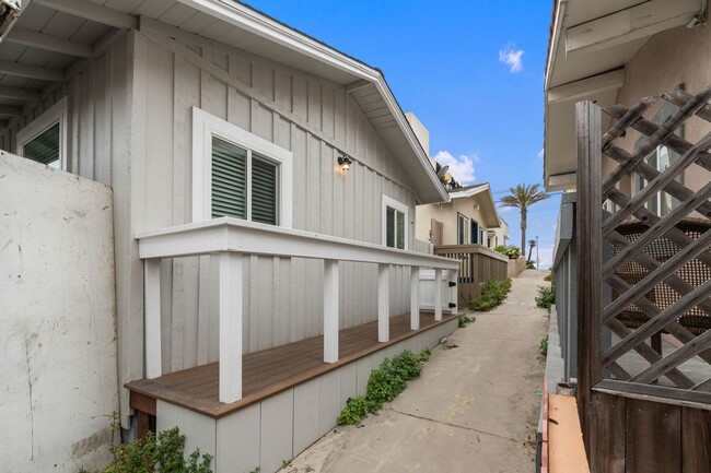 Building Photo - Beachside 3BR Home | Remodeled | AC | Garage Parking | Walk to Boardwalk