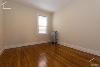 Building Photo - Large, newly renovated 3 bed near the Green Line and Commuter Rail!
