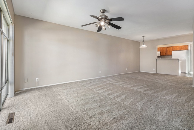 Building Photo - Charming Townhouse with Gas Fireplace & Basement Retreat in Columbine Lakes Community!
