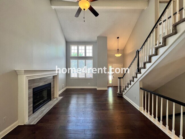 Building Photo - Maintenance Free Living w/ Hardwood Floors, Open Layout, Granite Counters, Finished Basement!