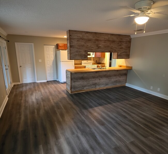 Building Photo - Corner Lot Charm: Spacious 4 Bed on Corner Lot w/ Custom Bookshelves & Private Storage Shed