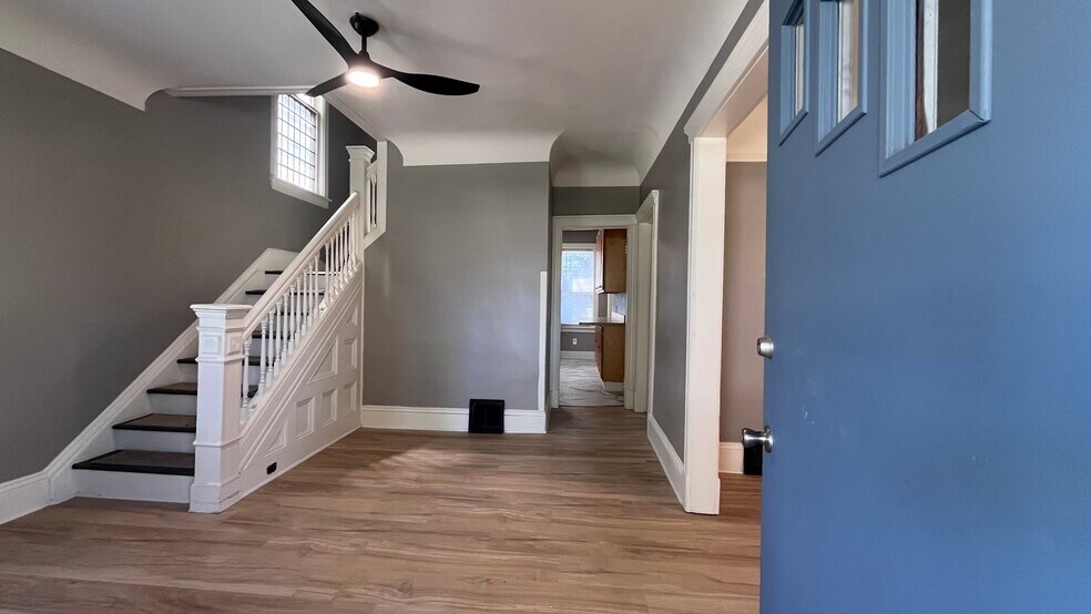 Foyer entrance with stairs to bedroom and dining room adjacent - 2366 E 85th St